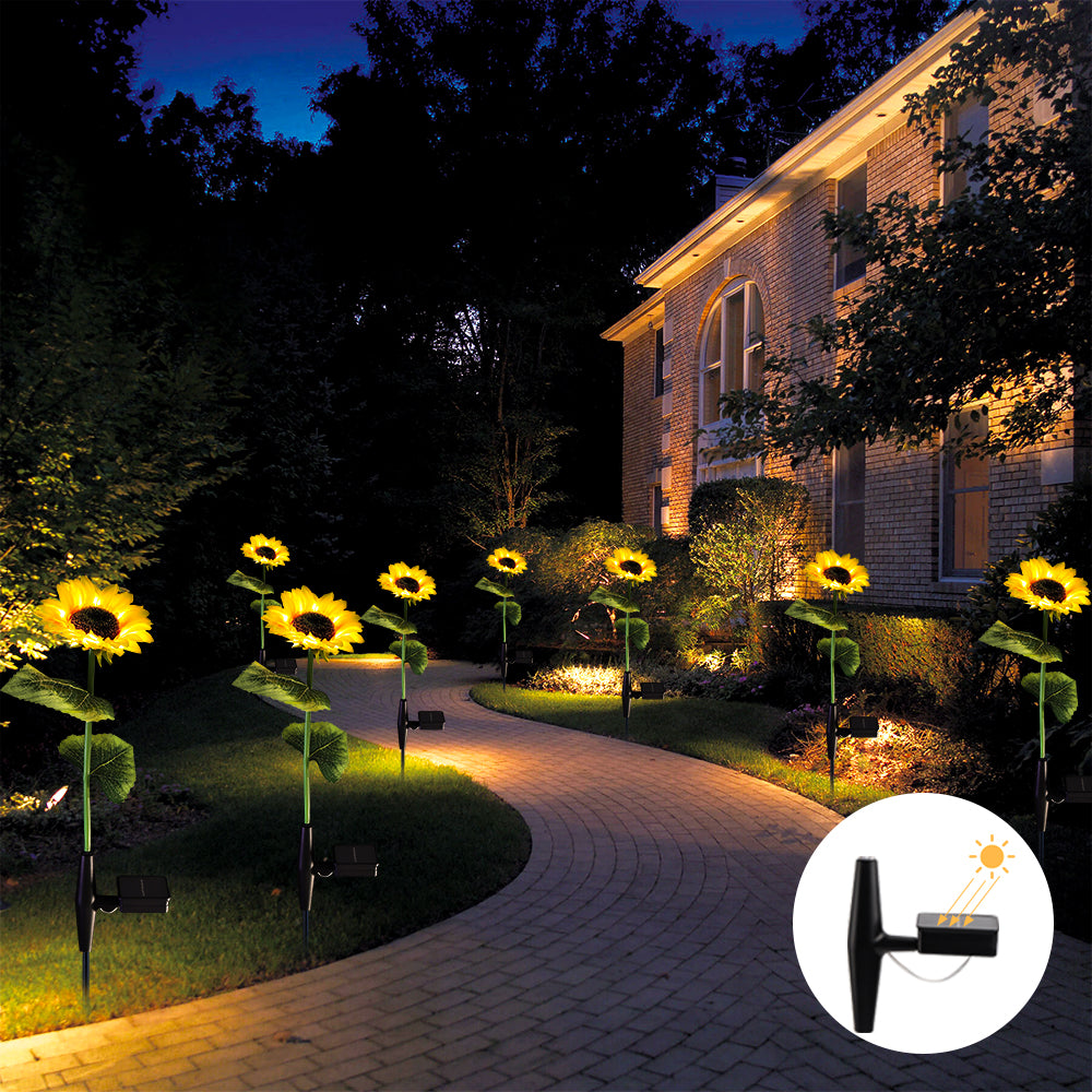 Two solar powered sunflower lights with warm white LEDs, designed for outdoor garden decoration, showcasing vibrant yellow petals and green stems.