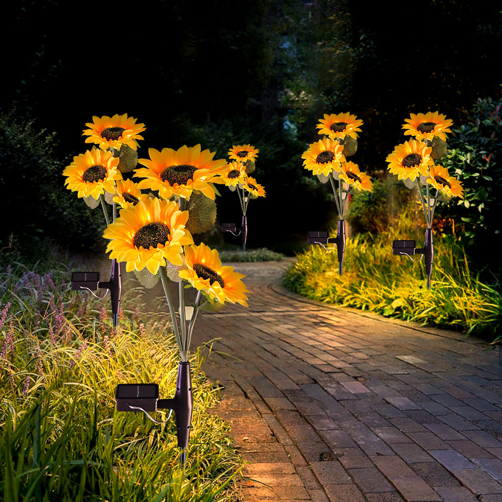 Two packs of solar powered sunflower lights with 30 LED bulbs, designed for outdoor garden decoration, showcasing vibrant yellow petals and green leaves.