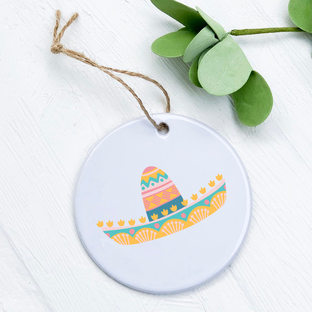 A beautifully crafted porcelain Sombrero Ornament featuring vibrant colors and intricate designs, perfect for gifting or home decor.