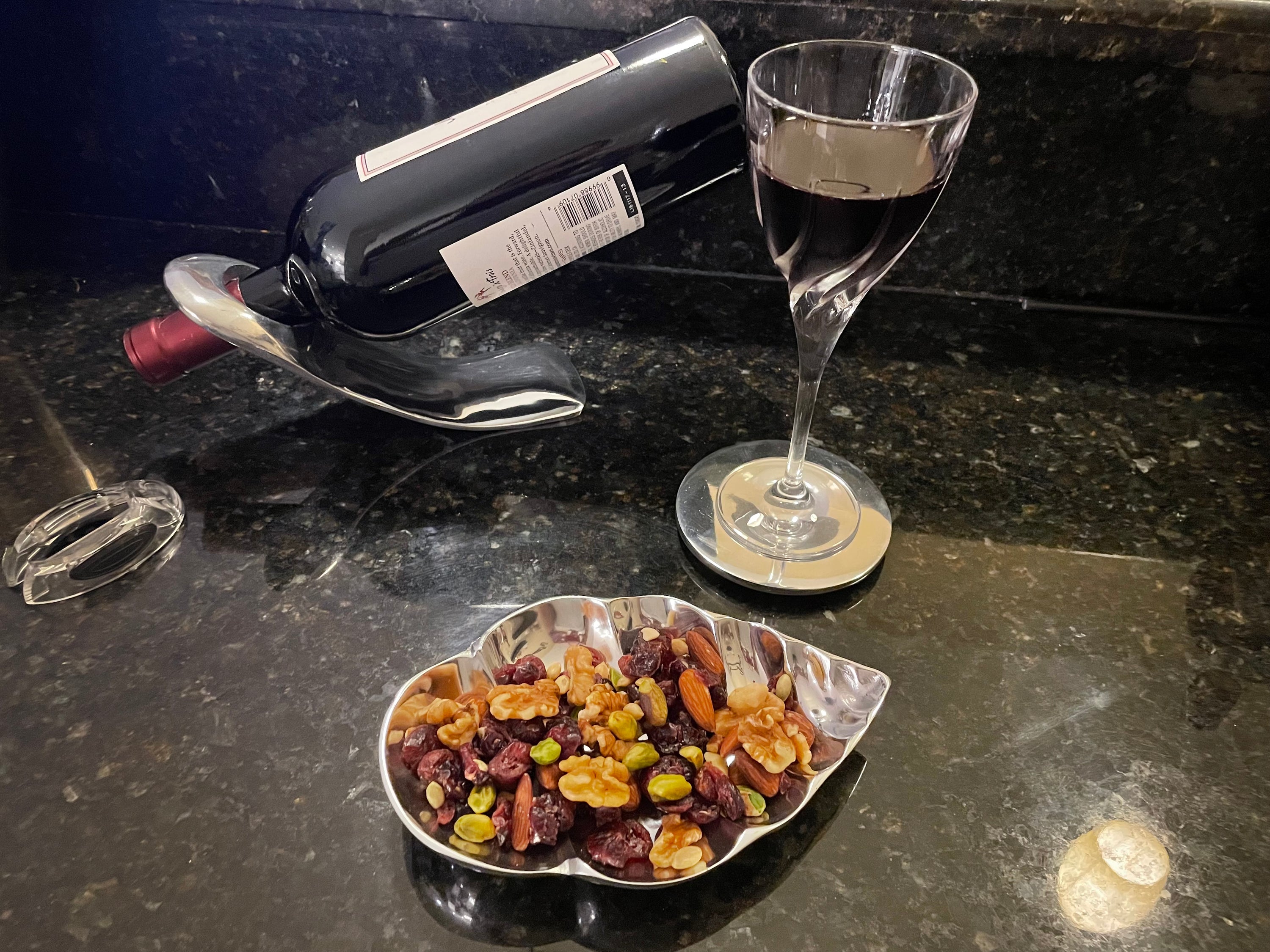 A stylish spiral-shaped snack bowl made from recycled aluminum, showcasing a unique wavy design perfect for serving snacks or as a decorative piece.