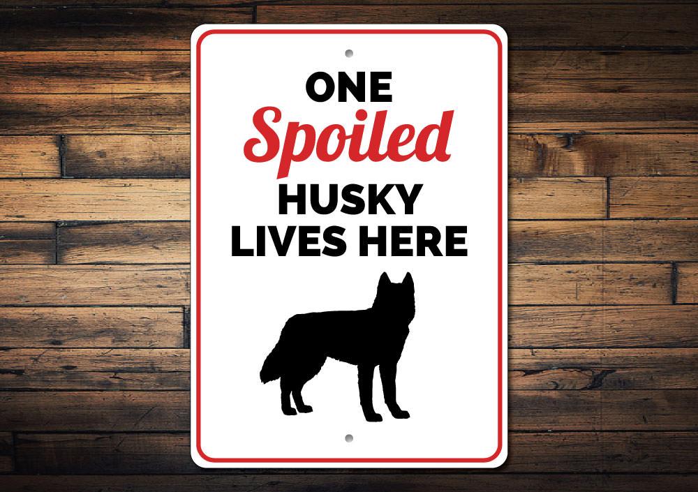 Spoiled Husky Sign featuring a playful design, made from durable aluminum, perfect for home decor.