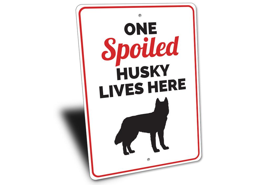 Spoiled Husky Sign featuring a playful design, made from durable aluminum, perfect for home decor.