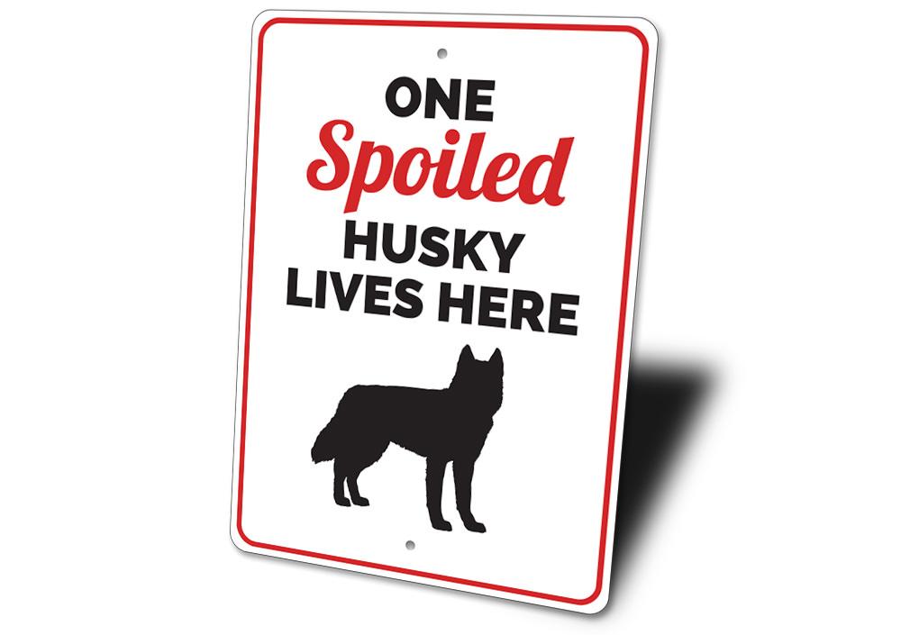 Spoiled Husky Sign featuring a playful design, made from durable aluminum, perfect for home decor.