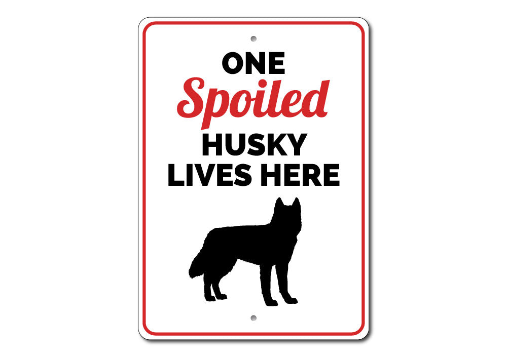 Spoiled Husky Sign featuring a playful design, made from durable aluminum, perfect for home decor.