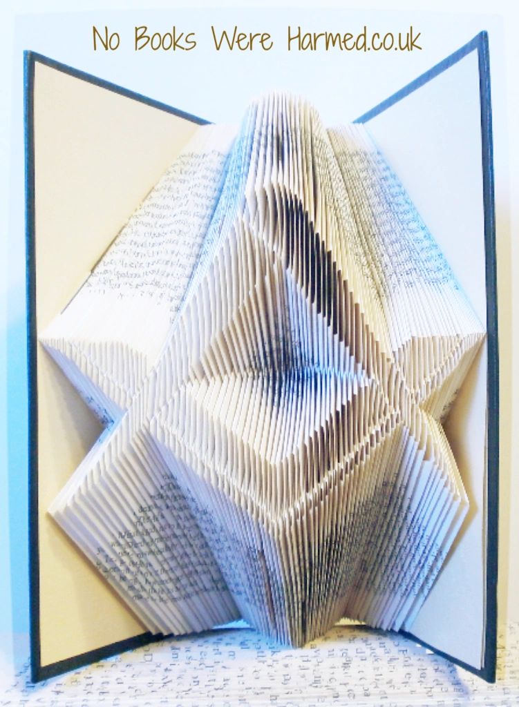 Hand-folded Square & Compass book art made from vintage pages, showcasing intricate geometric designs.