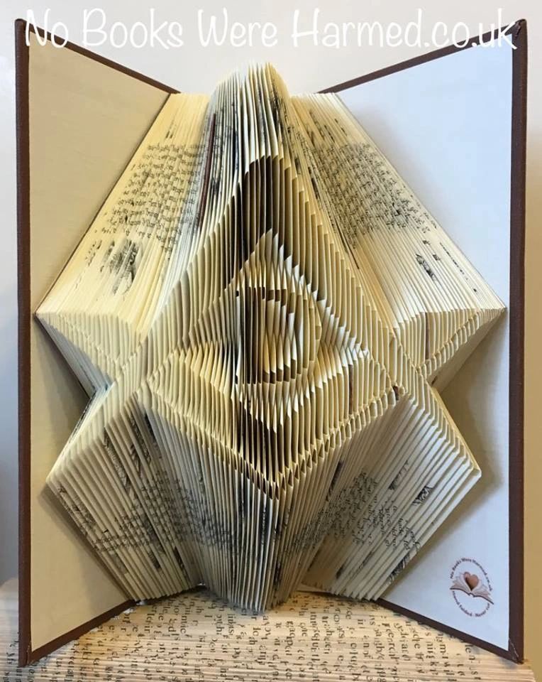 Hand-folded Square & Compass book art made from vintage pages, showcasing intricate geometric designs.