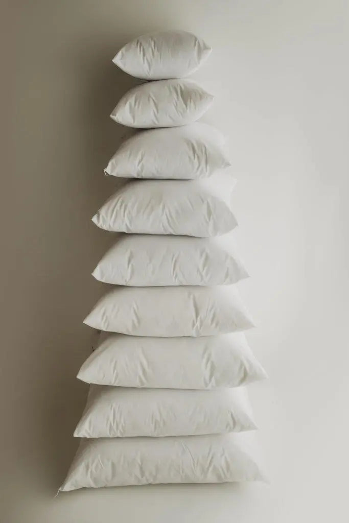 Bulk square pillow inserts in various sizes, showcasing their soft and durable fabric, ideal for decorative pillows.