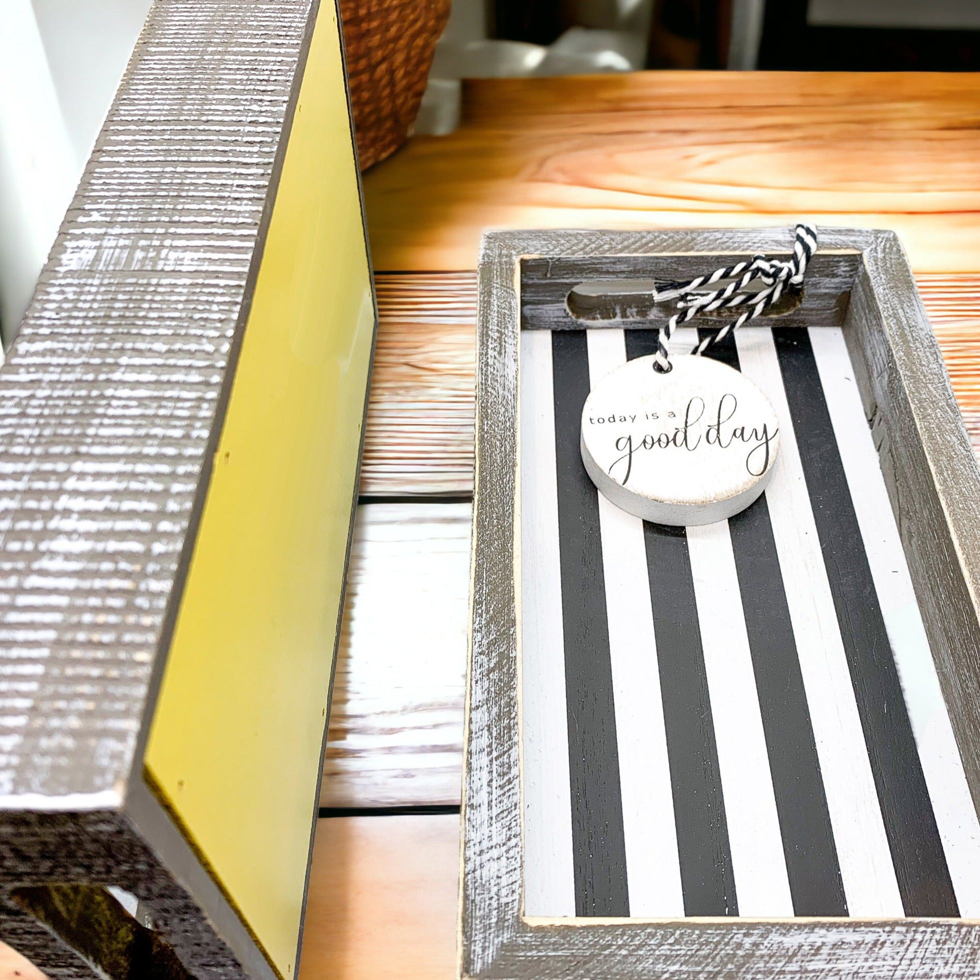 Handmade wooden tray with yellow striped interior and double-sided ornament featuring 'Squeeze The Day' and a lemon.