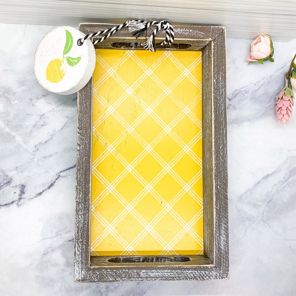 Handmade wooden tray with yellow striped interior and double-sided ornament featuring 'Squeeze The Day' and a lemon.