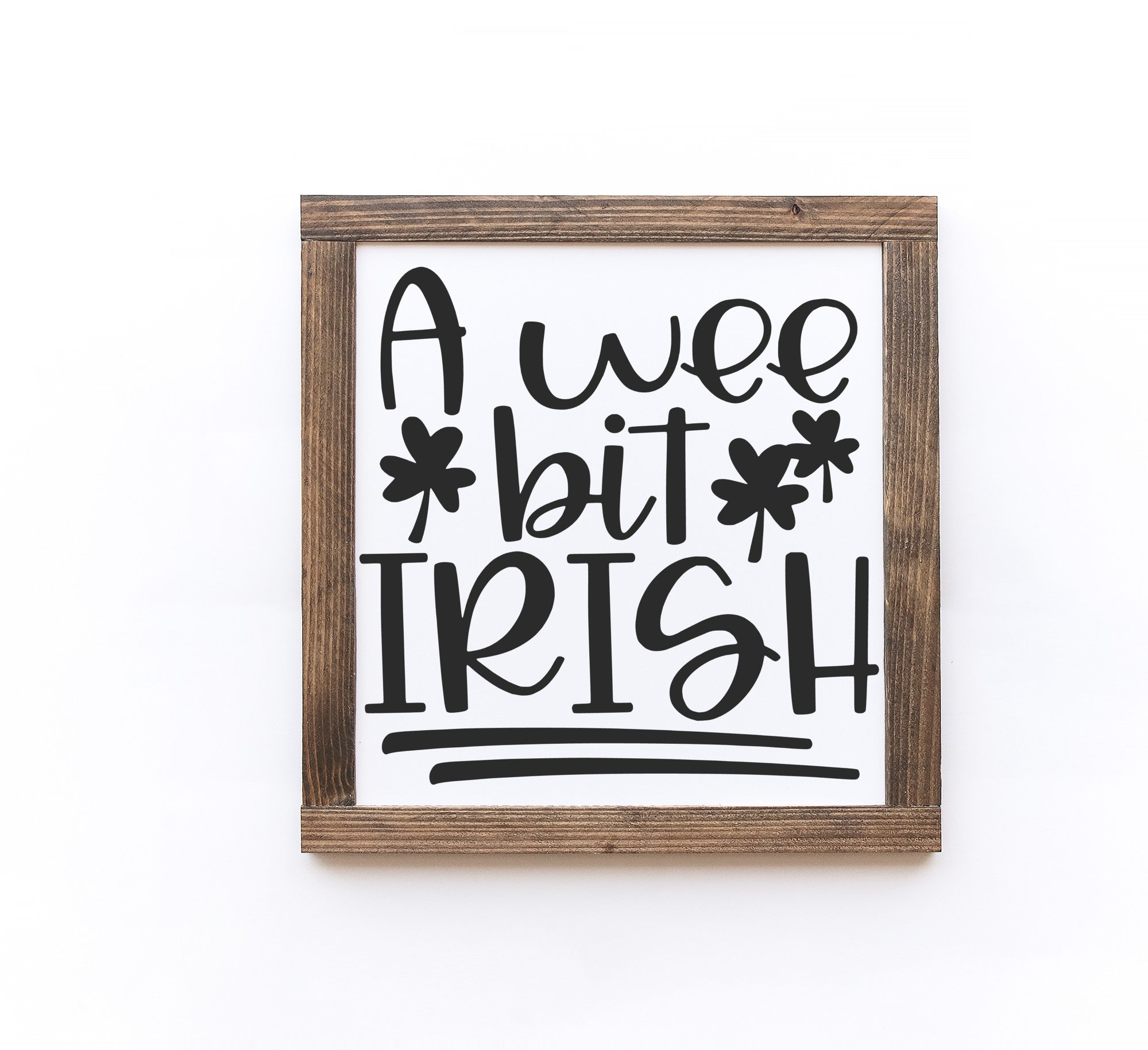 Handmade St. Patrick's Day wooden sign with white background and painted lettering, available in two sizes.