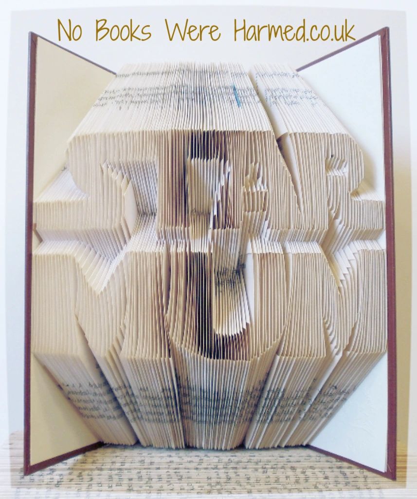 Handcrafted STAR MUM art piece made from folded pages of vintage books, showcasing intricate design and unique character.