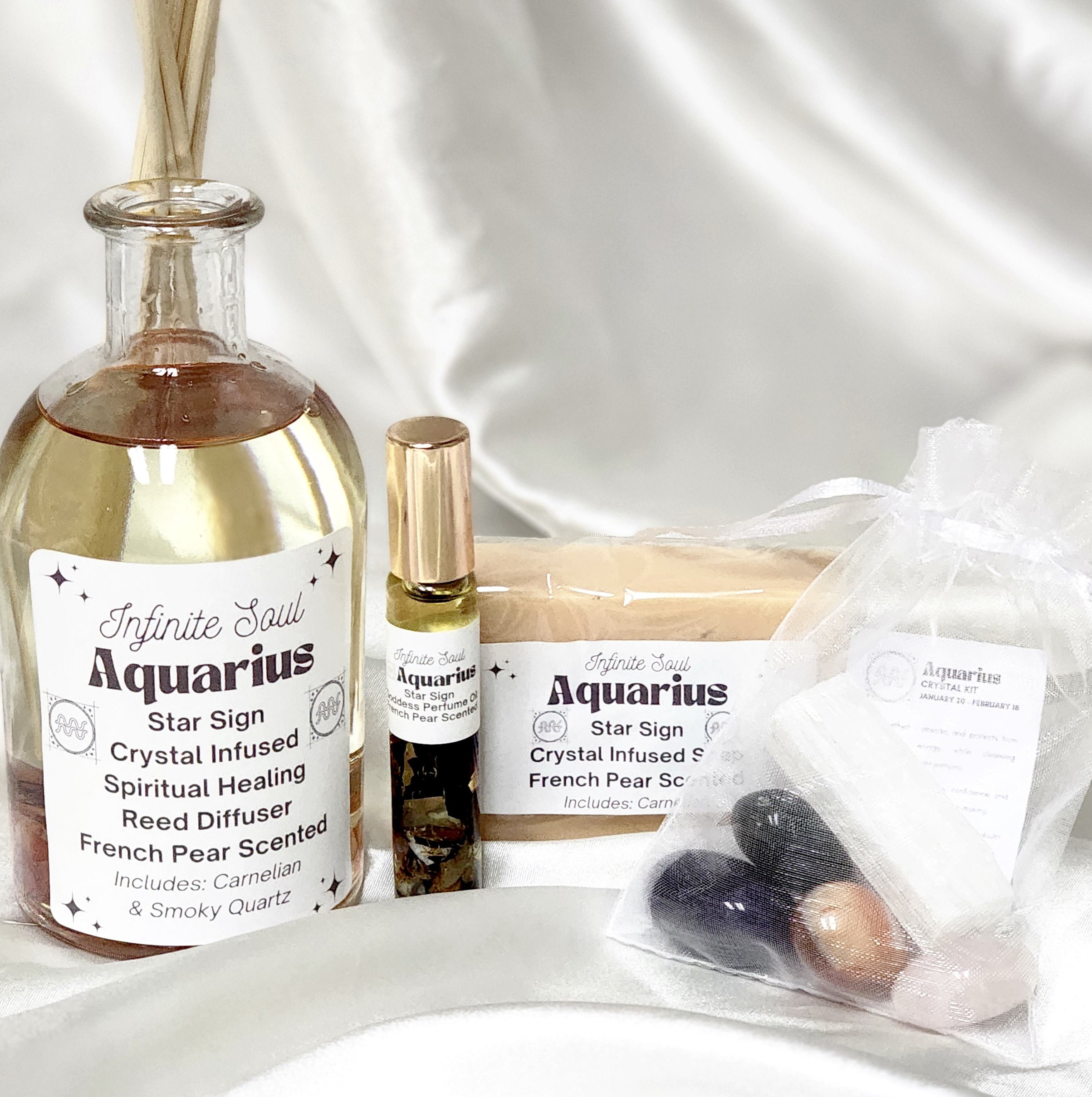 Star Sign Bundle: The Aquarius Collection featuring a healing candle, jewelry, perfume oil, and crystal kit, all designed for spiritual wellness.