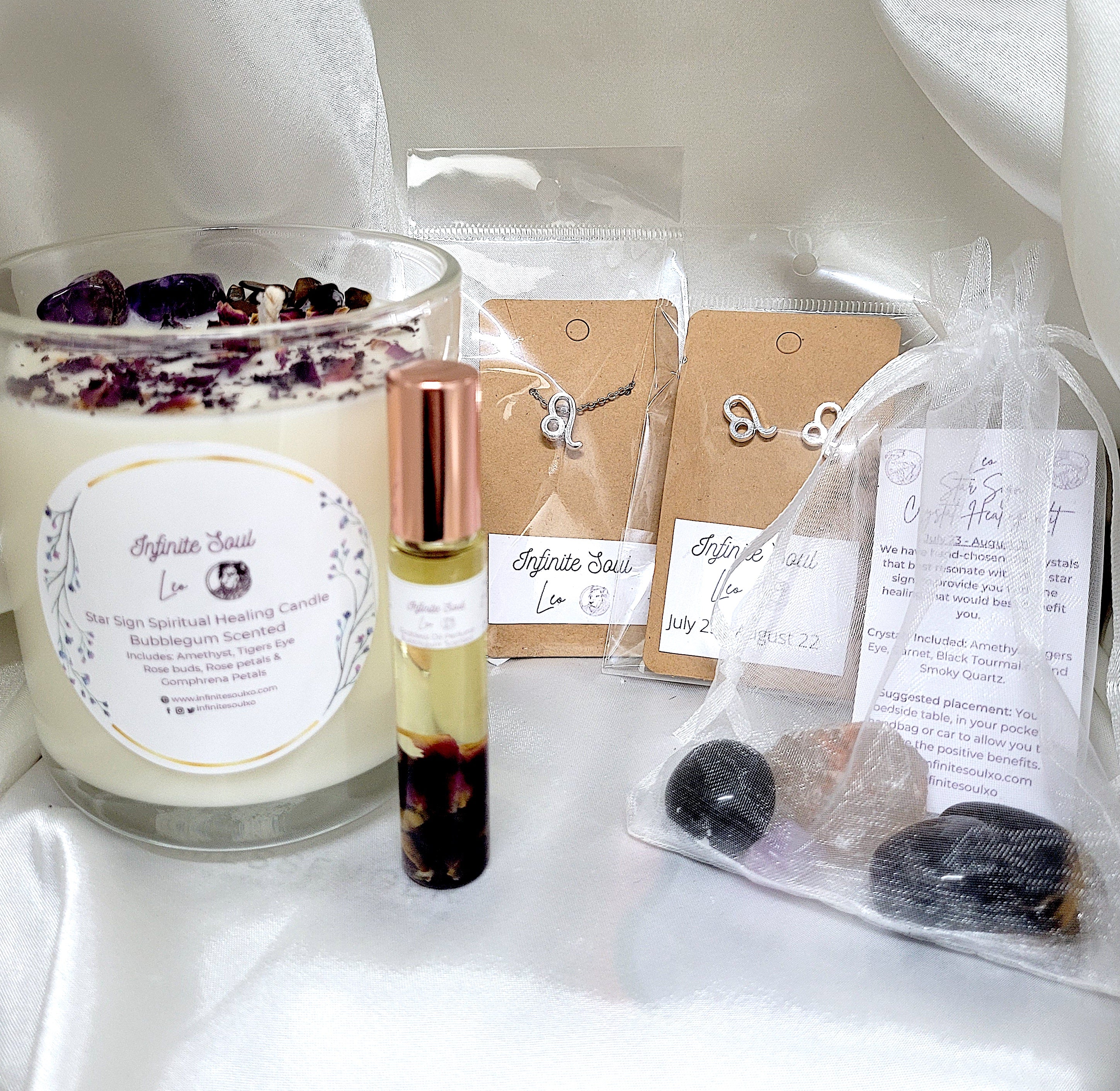 Star Sign Bundle: The Leo Collection featuring a healing candle, jewelry set, and bubblegum scented perfume oil, all designed for Leos.