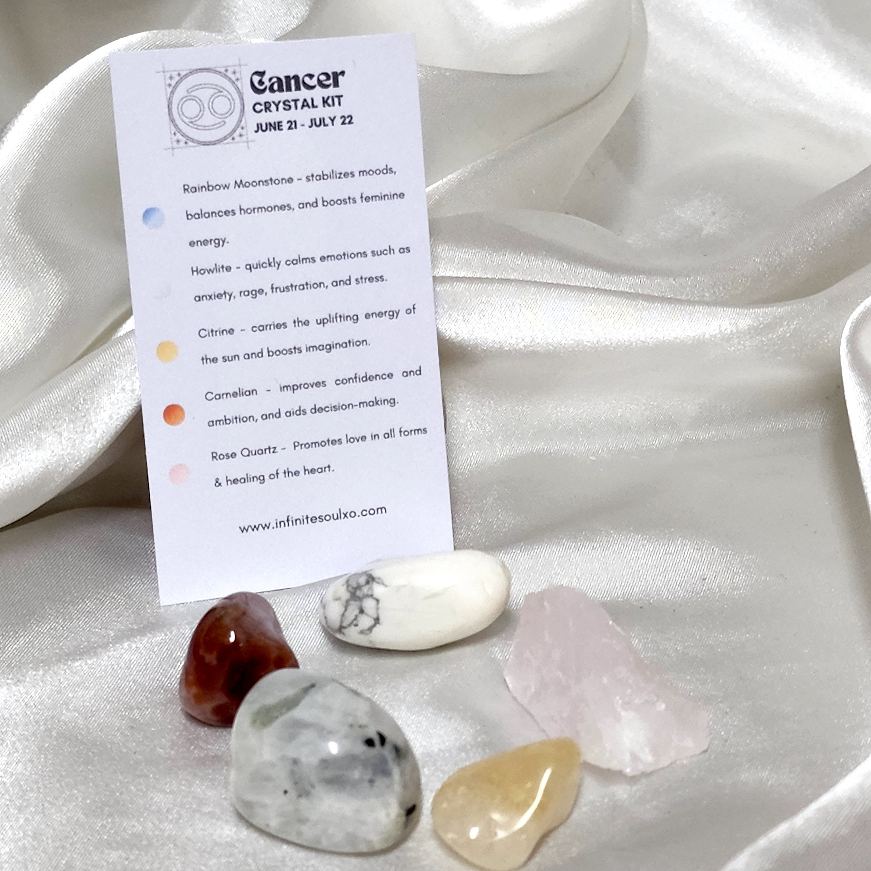 Star Sign Crystal Healing Kit for Cancer featuring Howlite, Carnelian, Rose Quartz, Rainbow Moonstone, and Citrine in a beautifully arranged display.