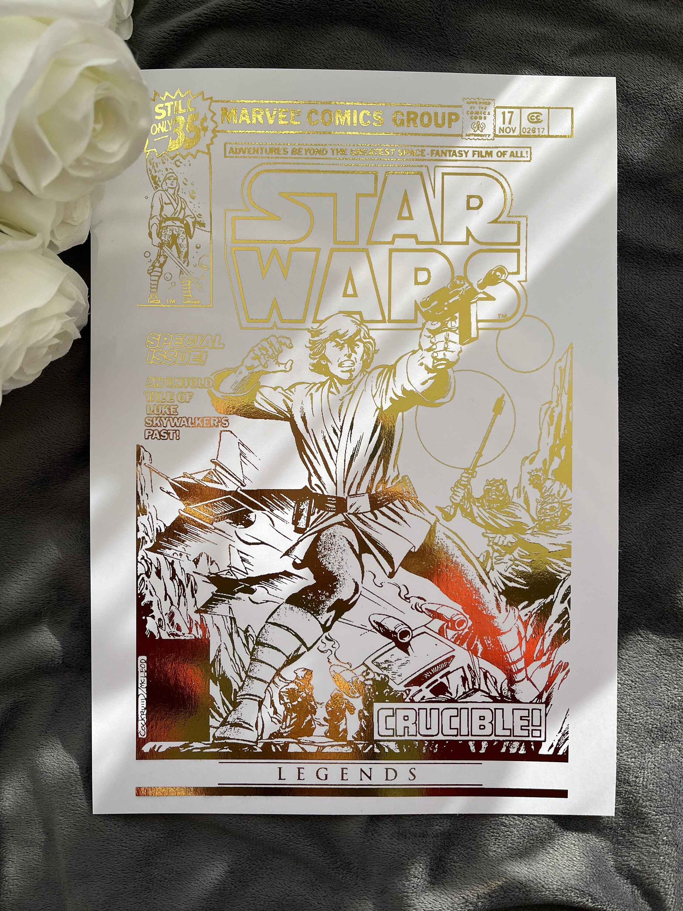 Star Wars comic cover foil print featuring iconic characters and gold foil detailing, perfect for fans and collectors.