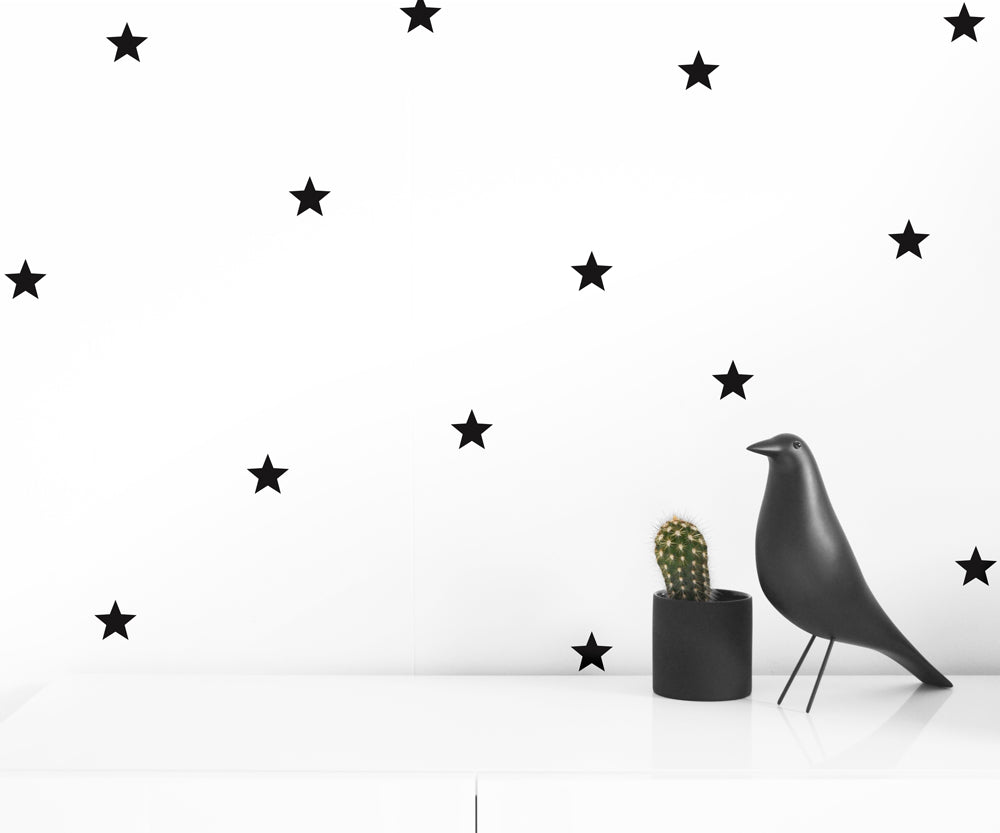 A collection of 50 self-adhesive stars in black and gray, perfect for wall decoration.