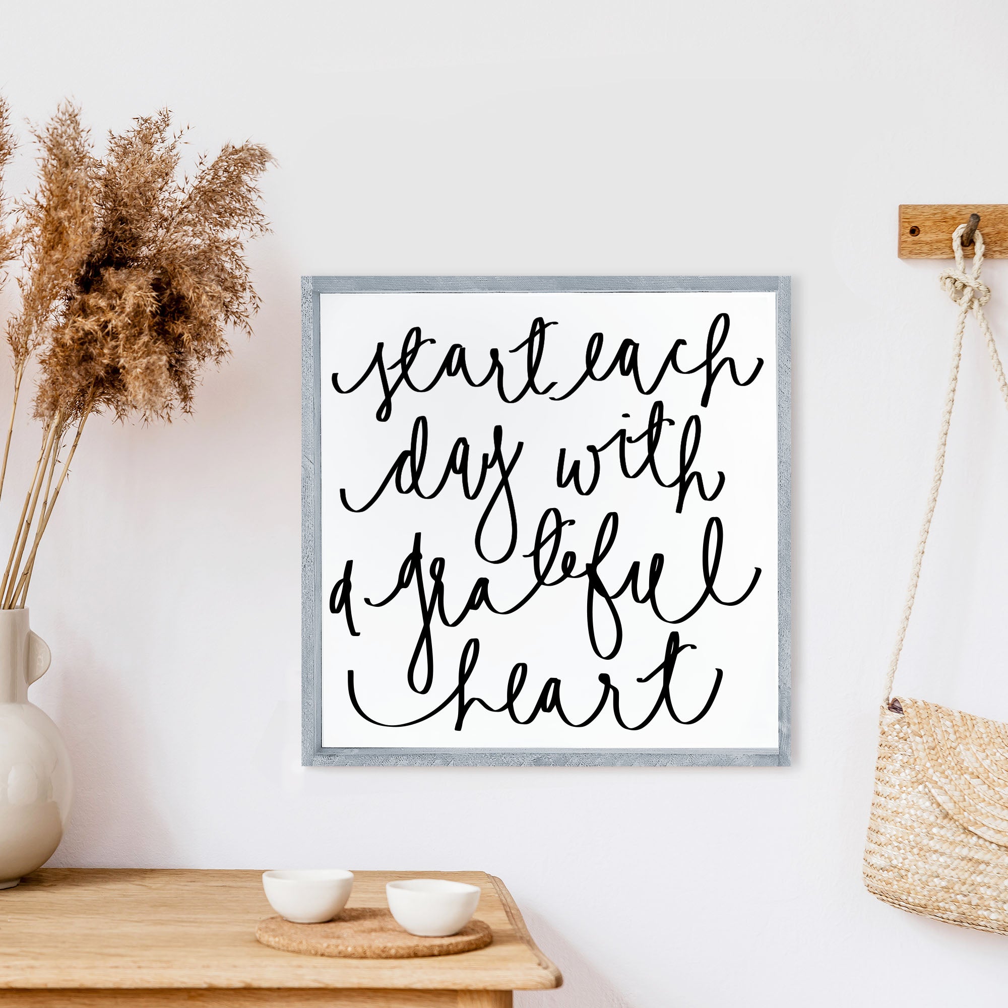 A beautifully crafted wood sign that reads 'Start Each Day With A Grateful Heart', featuring a pine wood frame and a white background.