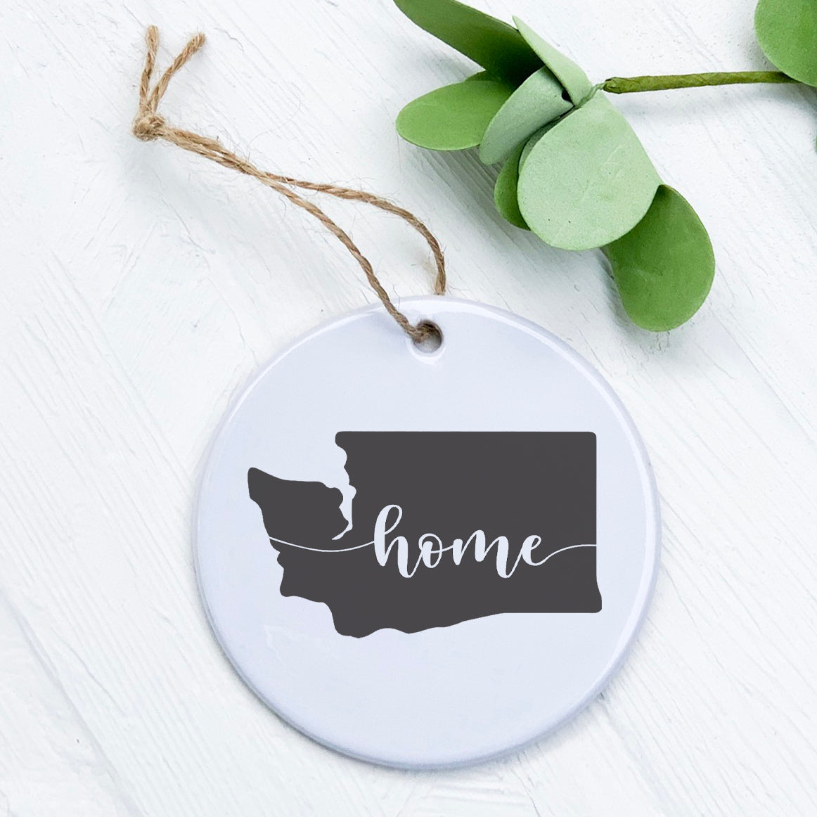 A beautifully crafted porcelain ornament featuring original designs, perfect for home decor or as a gift tag.