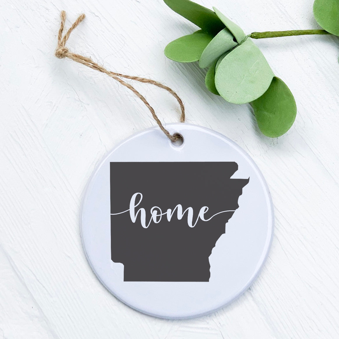 A beautifully crafted porcelain ornament featuring original designs, perfect for home decor or as a gift tag.