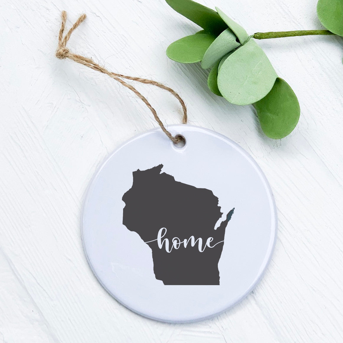 A beautifully crafted porcelain ornament featuring original designs, perfect for home decor or as a gift tag.