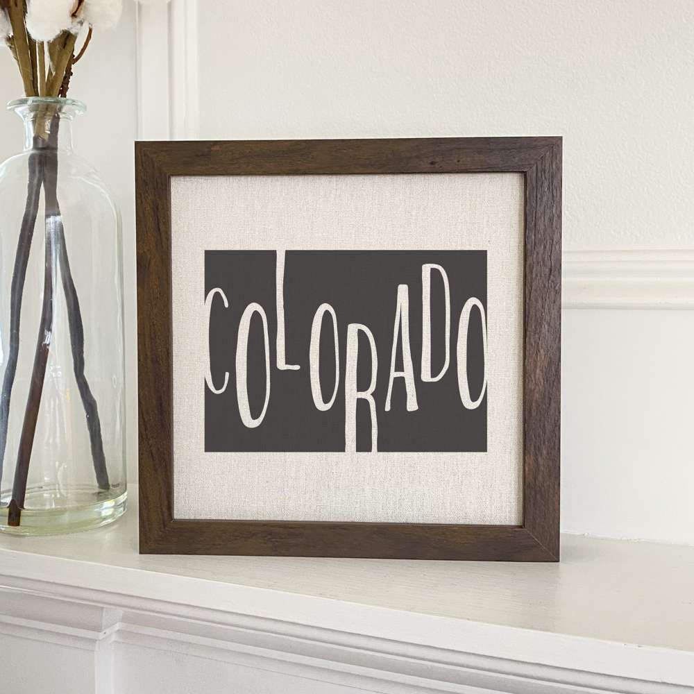 Stylish State Art Framed Sign with a wood frame, featuring eco-friendly printing on a linen-look background.