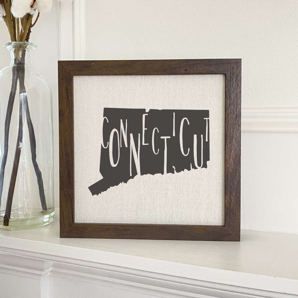 Stylish State Art Framed Sign with a wood frame, featuring eco-friendly printing on a linen-look background.