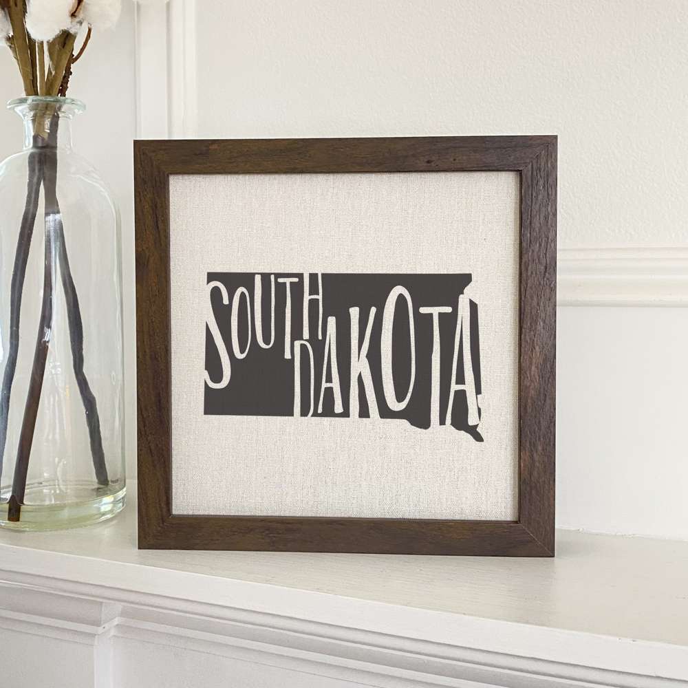 Stylish State Art Framed Sign with a wood frame, featuring eco-friendly printing on a linen-look background.