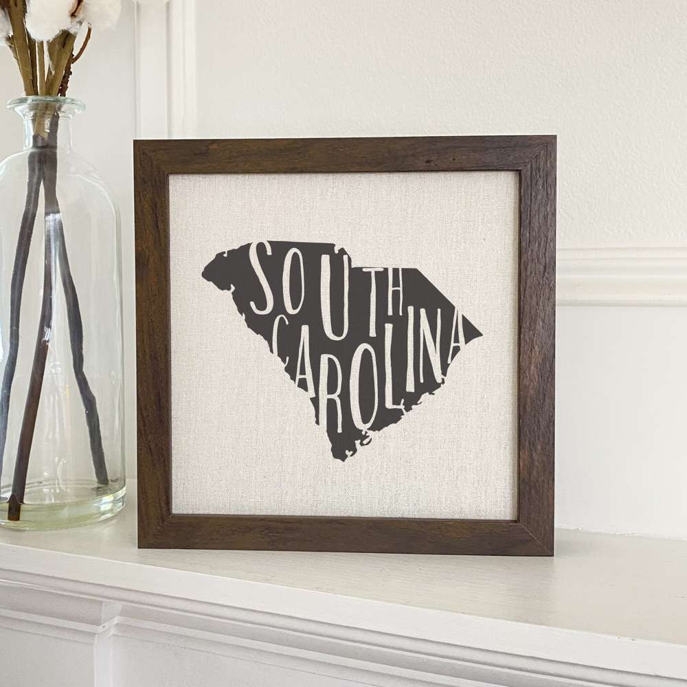 Stylish State Art Framed Sign with a wood frame, featuring eco-friendly printing on a linen-look background.