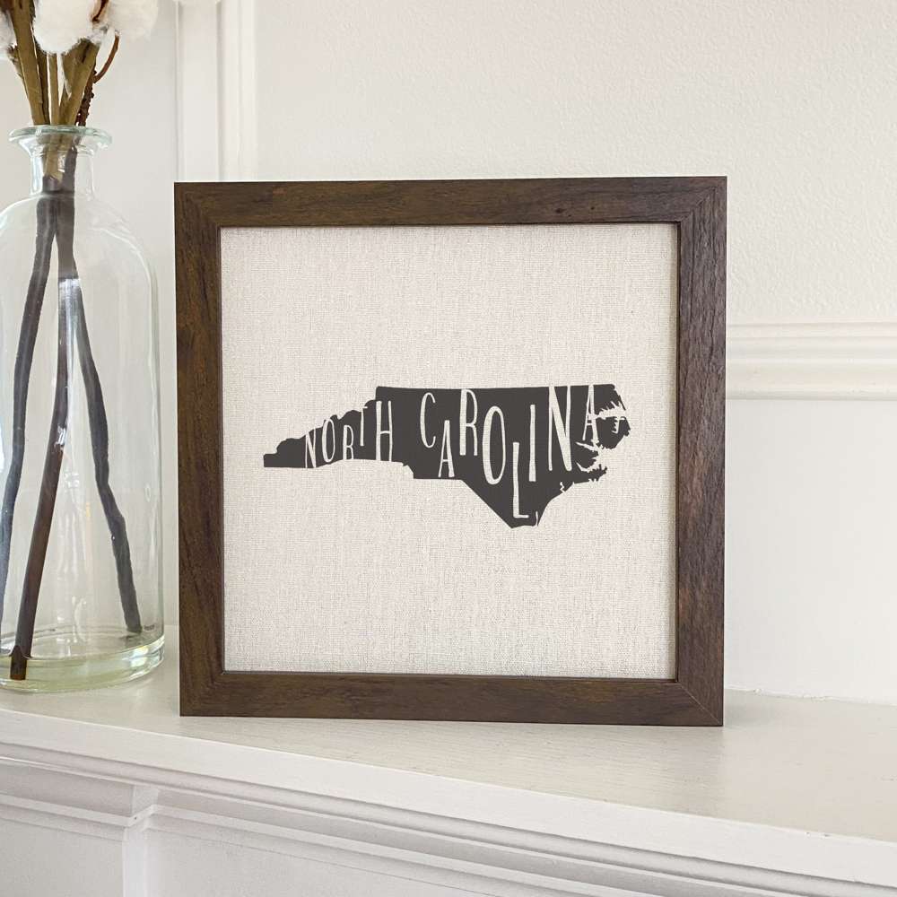 Stylish State Art Framed Sign with a wood frame, featuring eco-friendly printing on a linen-look background.