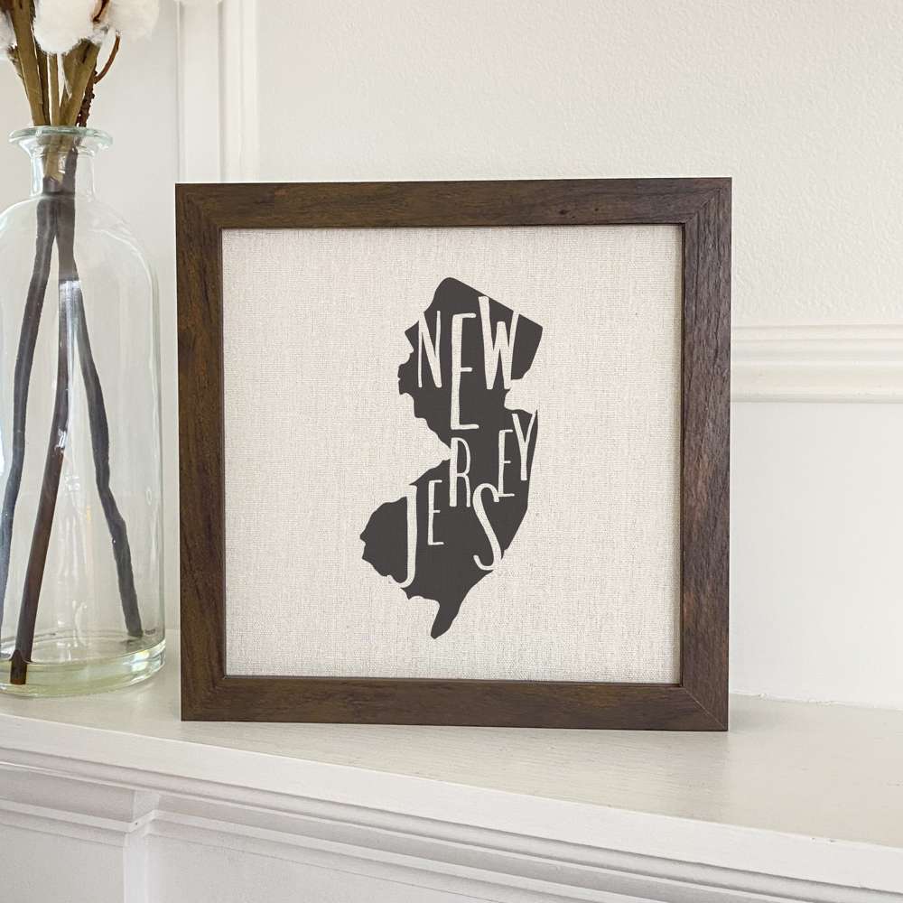 Stylish State Art Framed Sign with a wood frame, featuring eco-friendly printing on a linen-look background.