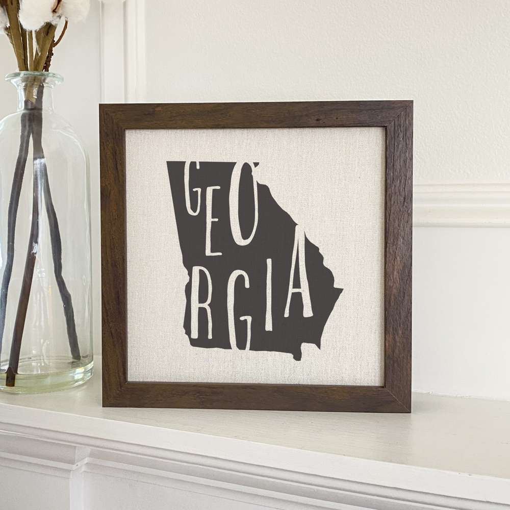 Stylish State Art Framed Sign with a wood frame, featuring eco-friendly printing on a linen-look background.