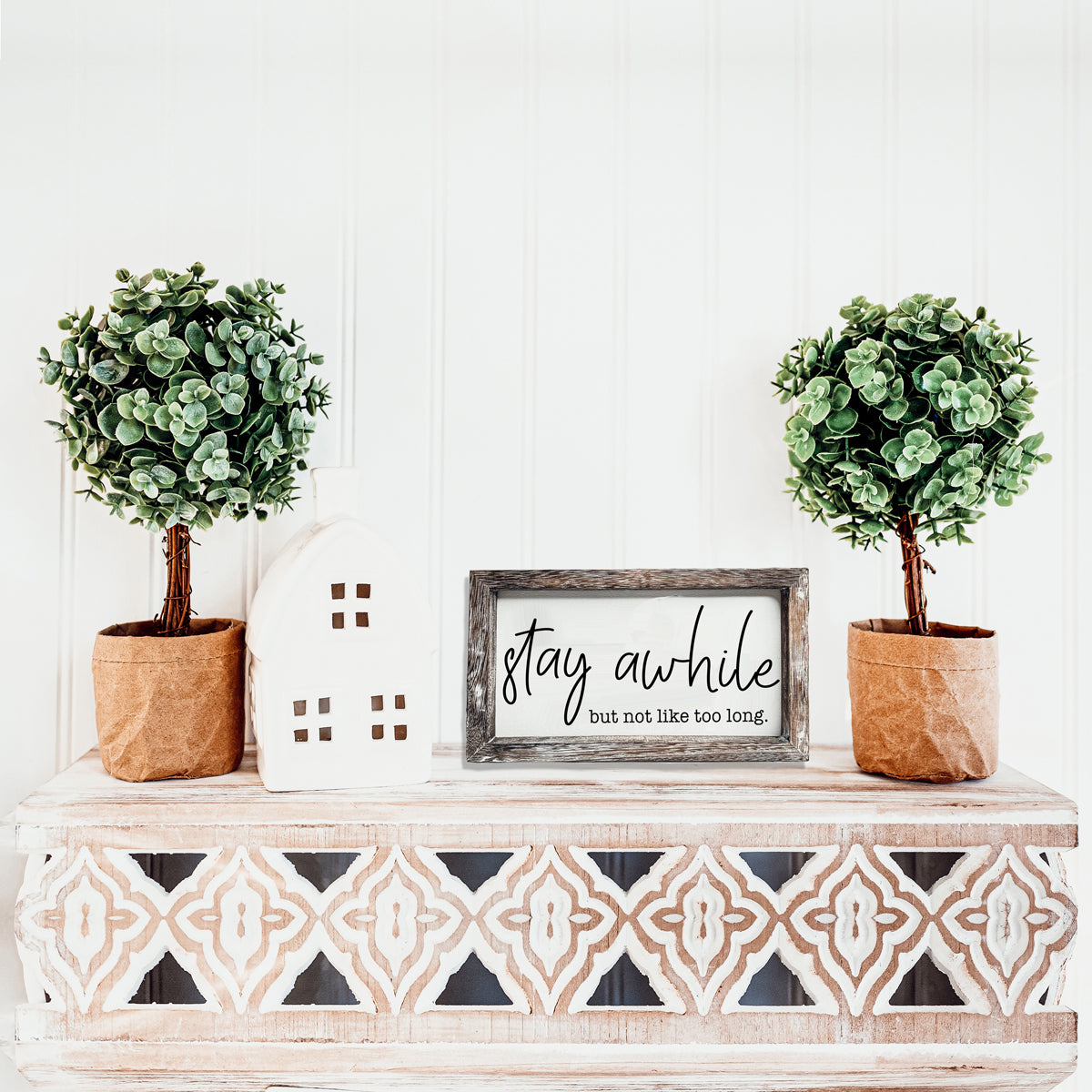 Stay Awhile Sign made of Paulownia wood featuring a humorous message, designed for wall hanging or standing display.