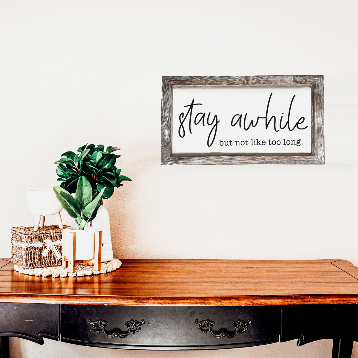 Stay Awhile Sign made of Paulownia wood featuring a humorous message, designed for wall hanging or standing display.