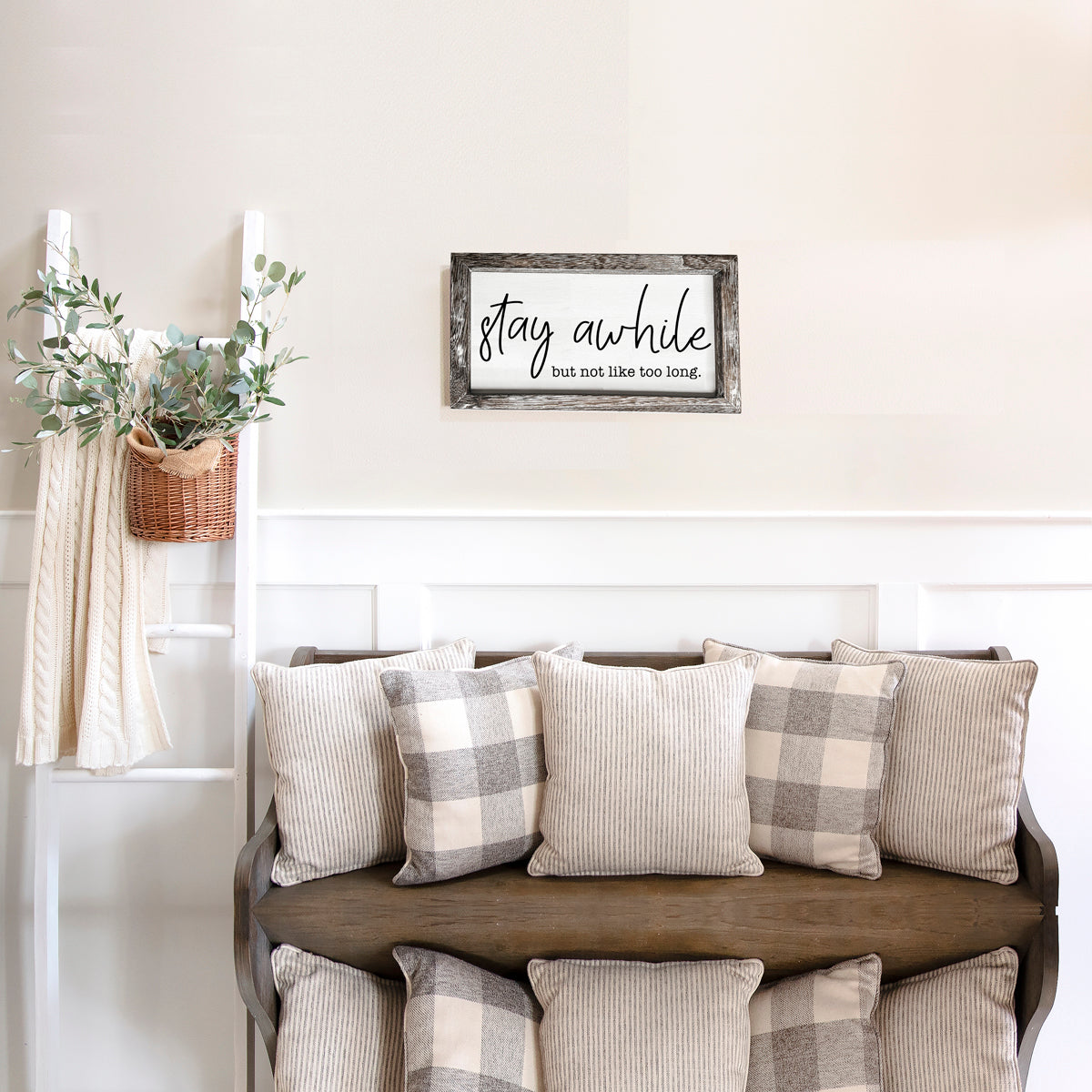 Stay Awhile Sign made of Paulownia wood featuring a humorous message, designed for wall hanging or standing display.