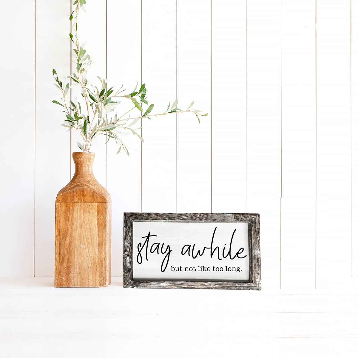 Stay Awhile Sign made of Paulownia wood featuring a humorous message, designed for wall hanging or standing display.