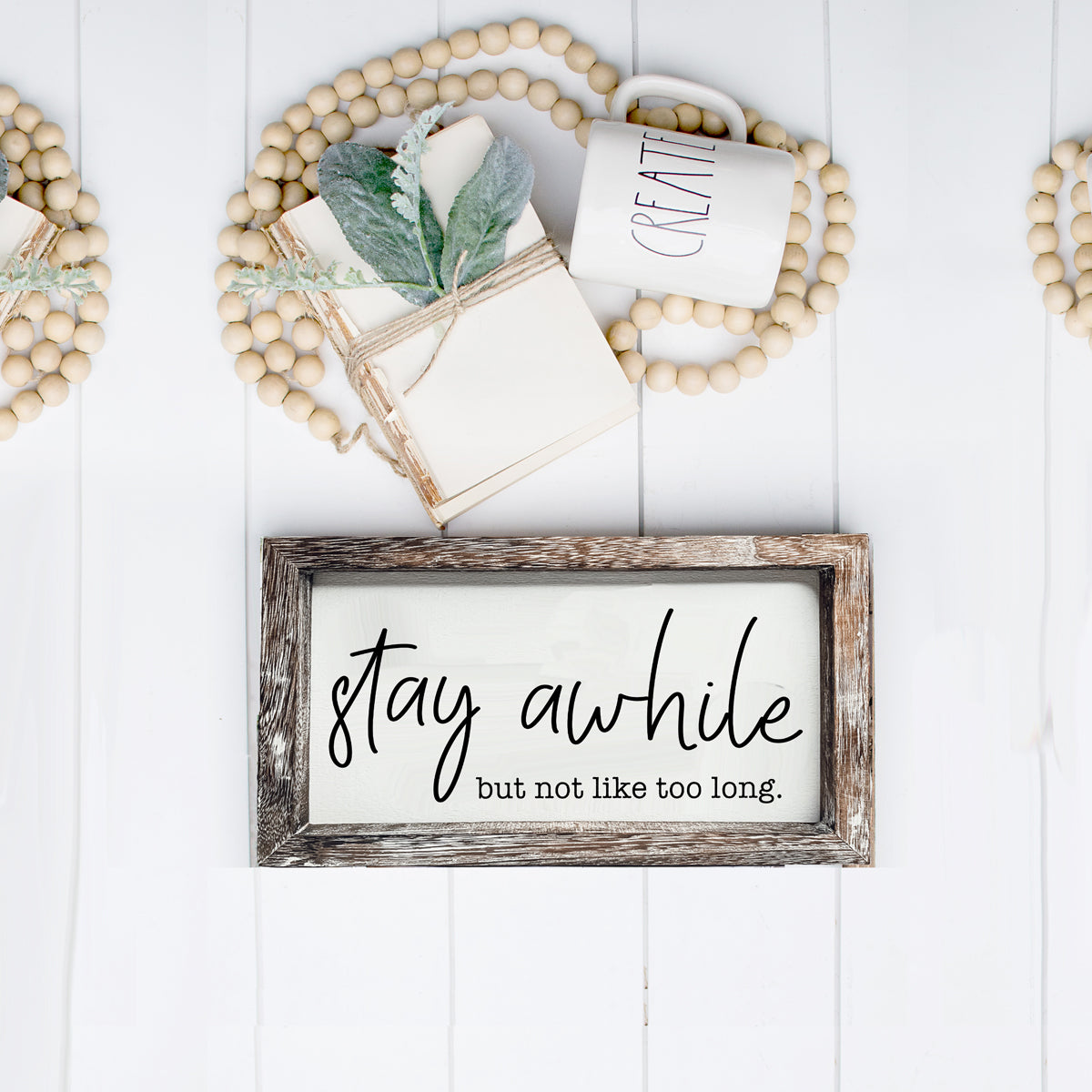 Stay Awhile Sign made of Paulownia wood featuring a humorous message, designed for wall hanging or standing display.