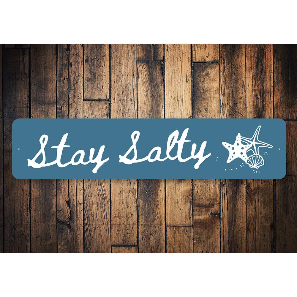 Stay Salty Beach Sign made of high-quality aluminum, featuring a coastal design perfect for beach houses and decor.