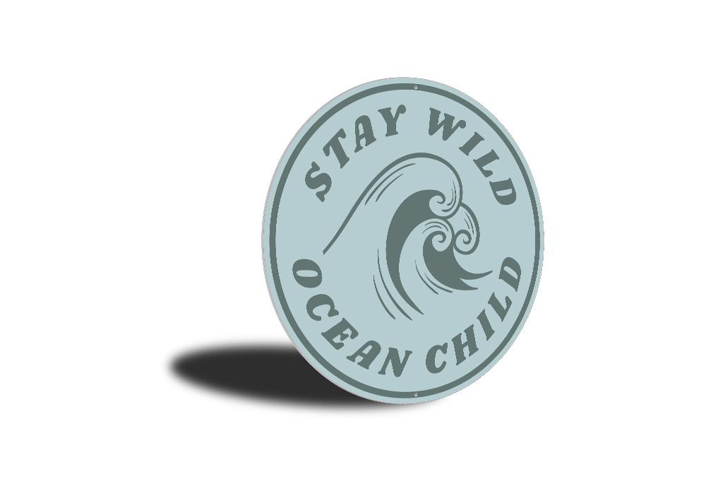 Stay Wild Ocean Child Sign made of aluminum, featuring a beach-themed design, perfect for coastal decor.