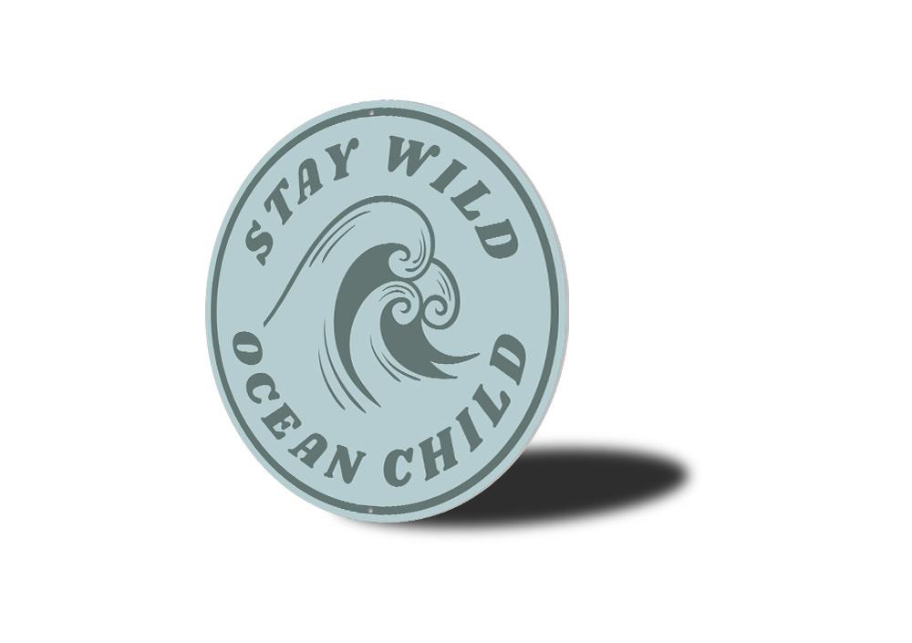 Stay Wild Ocean Child Sign made of aluminum, featuring a beach-themed design, perfect for coastal decor.