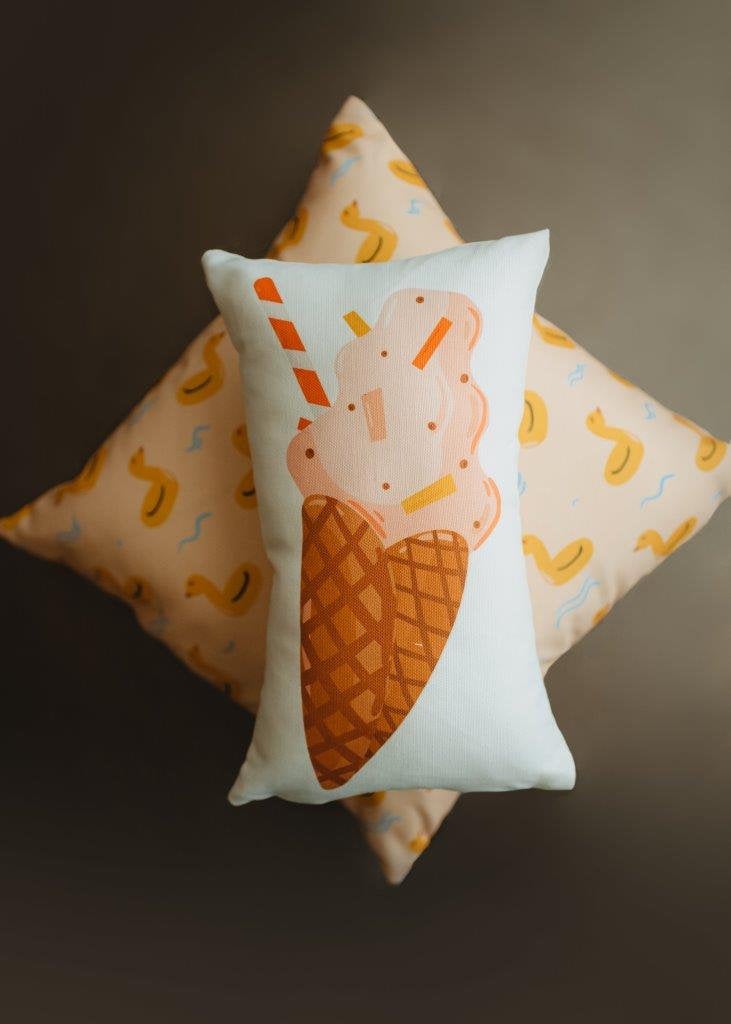 A charming 12x16 pillow cover featuring a vintage strawberry ice cream design on a waffle cone, perfect for summer decor.