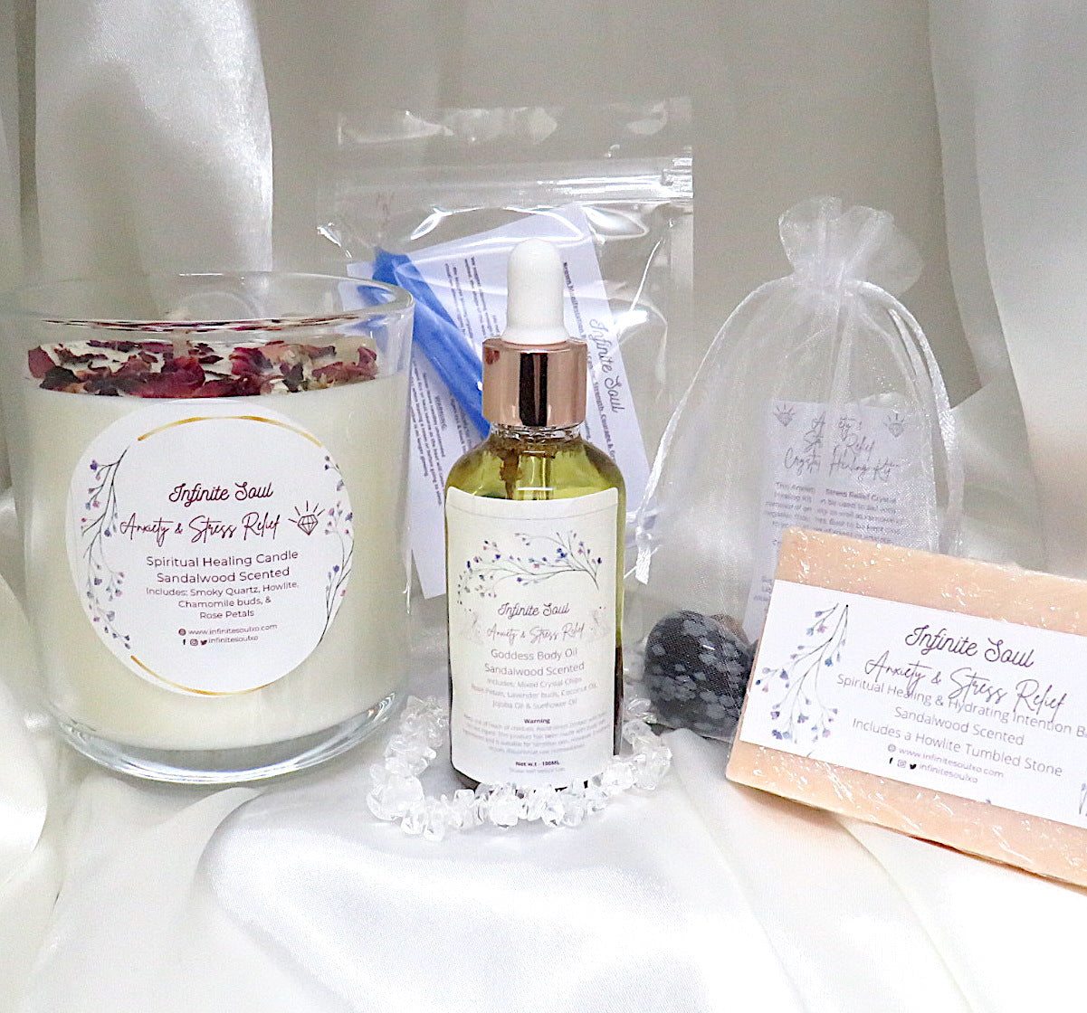 Stress Less Anxiety & Stress Relief Bundle featuring candles, crystals, body oil, and a notebook for relaxation and emotional healing.