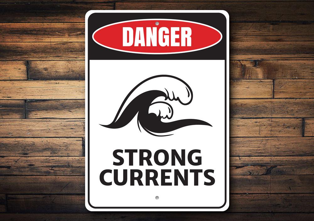 Strong Currents Danger Sign made of durable aluminum, featuring a beach-themed design, ideal for coastal decor.