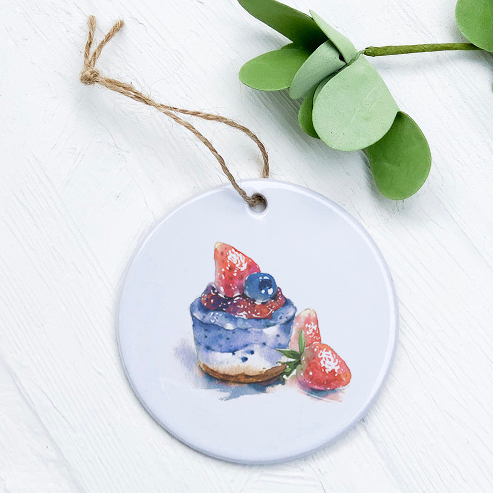 A beautifully crafted Summer Cheesecake ornament made of high-quality porcelain, featuring a vibrant design, perfect for gifting or decoration.