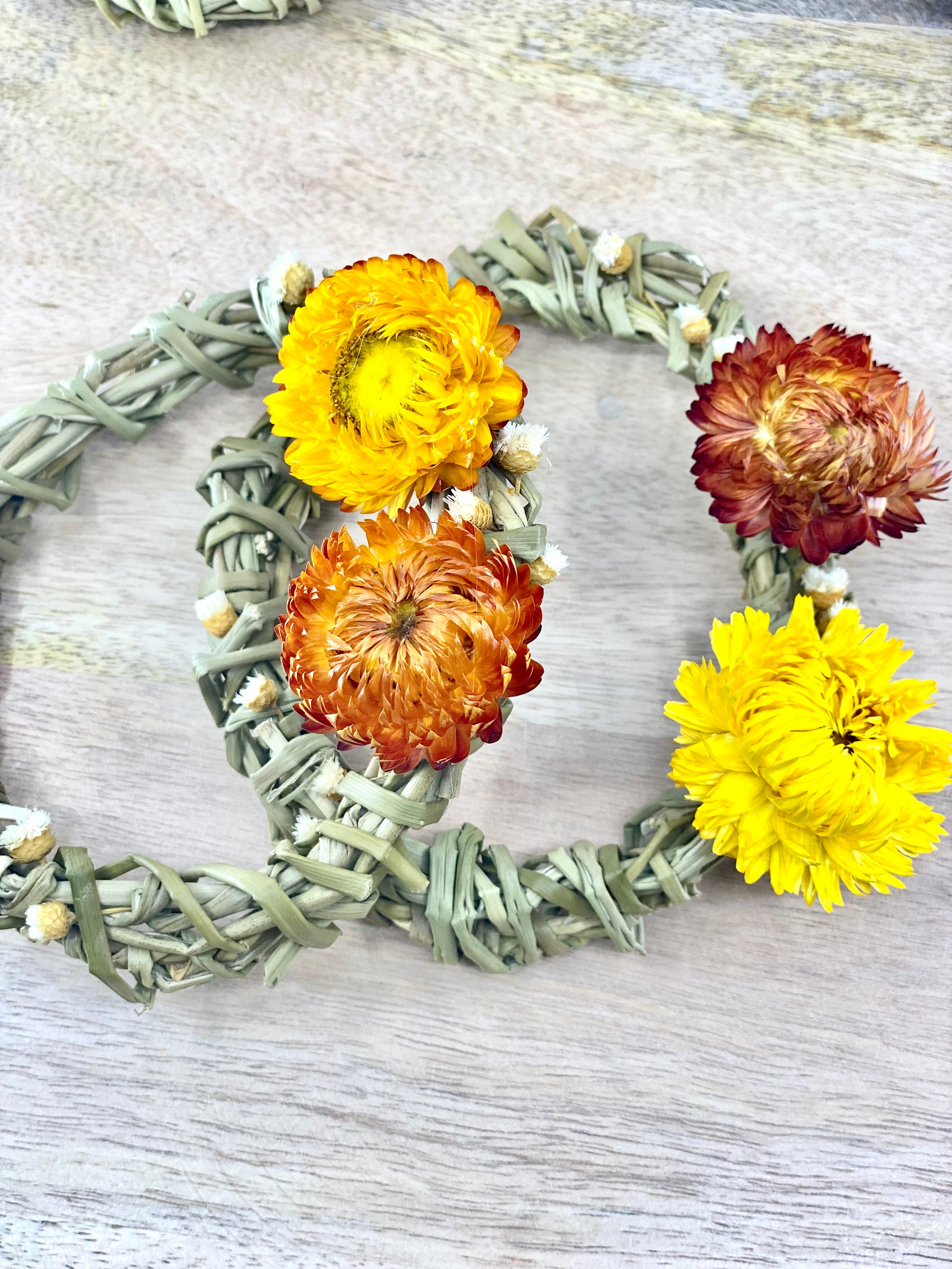 A 4-inch Summer Harvest Sweetgrass Wreath Ornament made with dried flowers, showcasing its delicate and lightweight design.