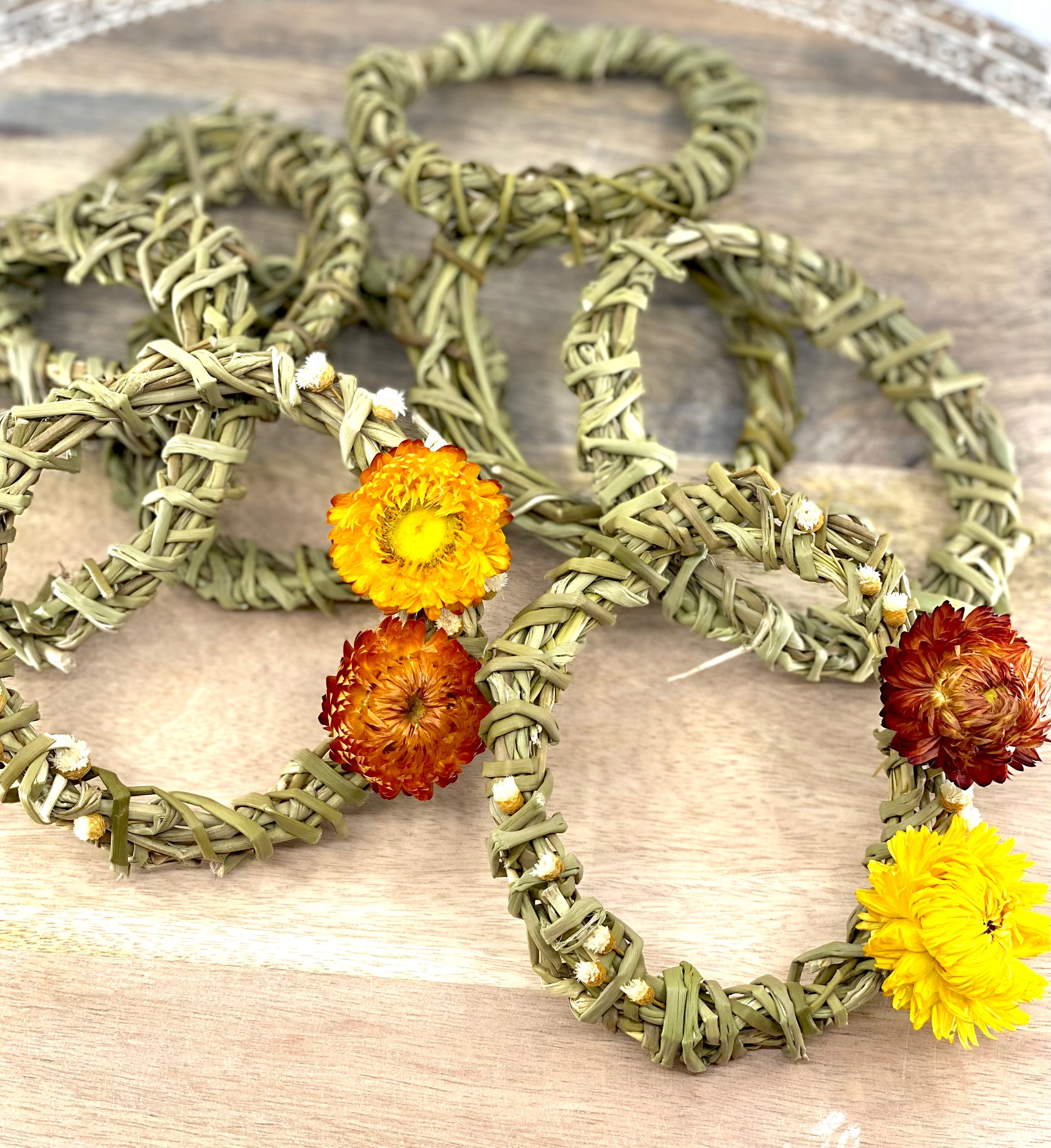 A 4-inch Summer Harvest Sweetgrass Wreath Ornament made with dried flowers, showcasing its delicate and lightweight design.