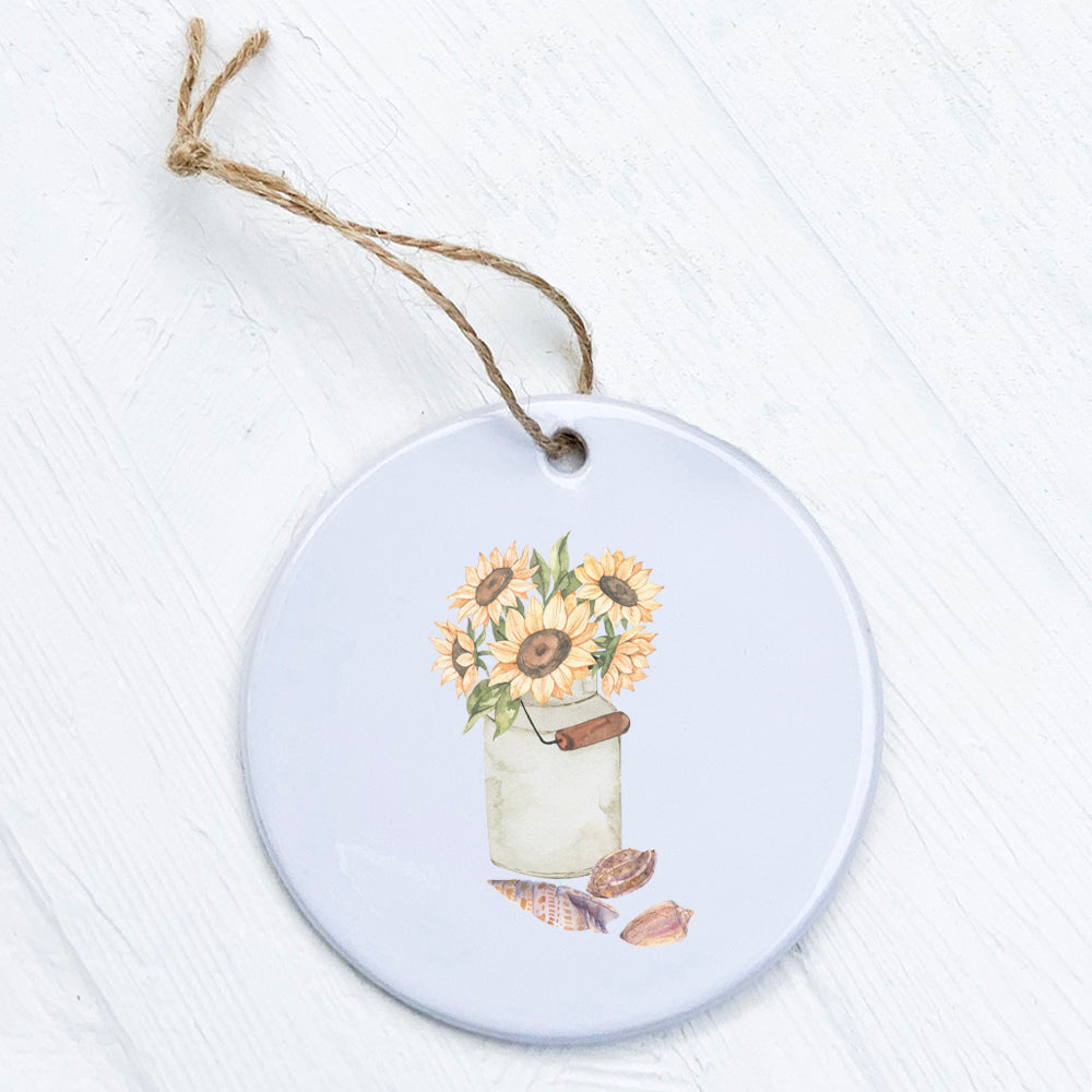 A beautifully crafted porcelain ornament featuring sunflowers and seashells design, showcasing vibrant colors and a smooth gloss finish.