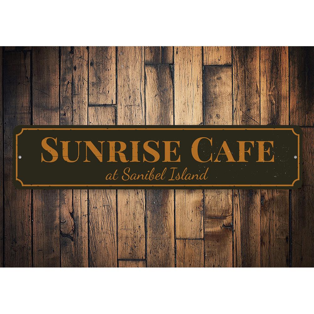 A beautifully crafted Sunrise Cafe Sign made of aluminum, featuring vibrant colors and customizable text, perfect for beach-themed decor.