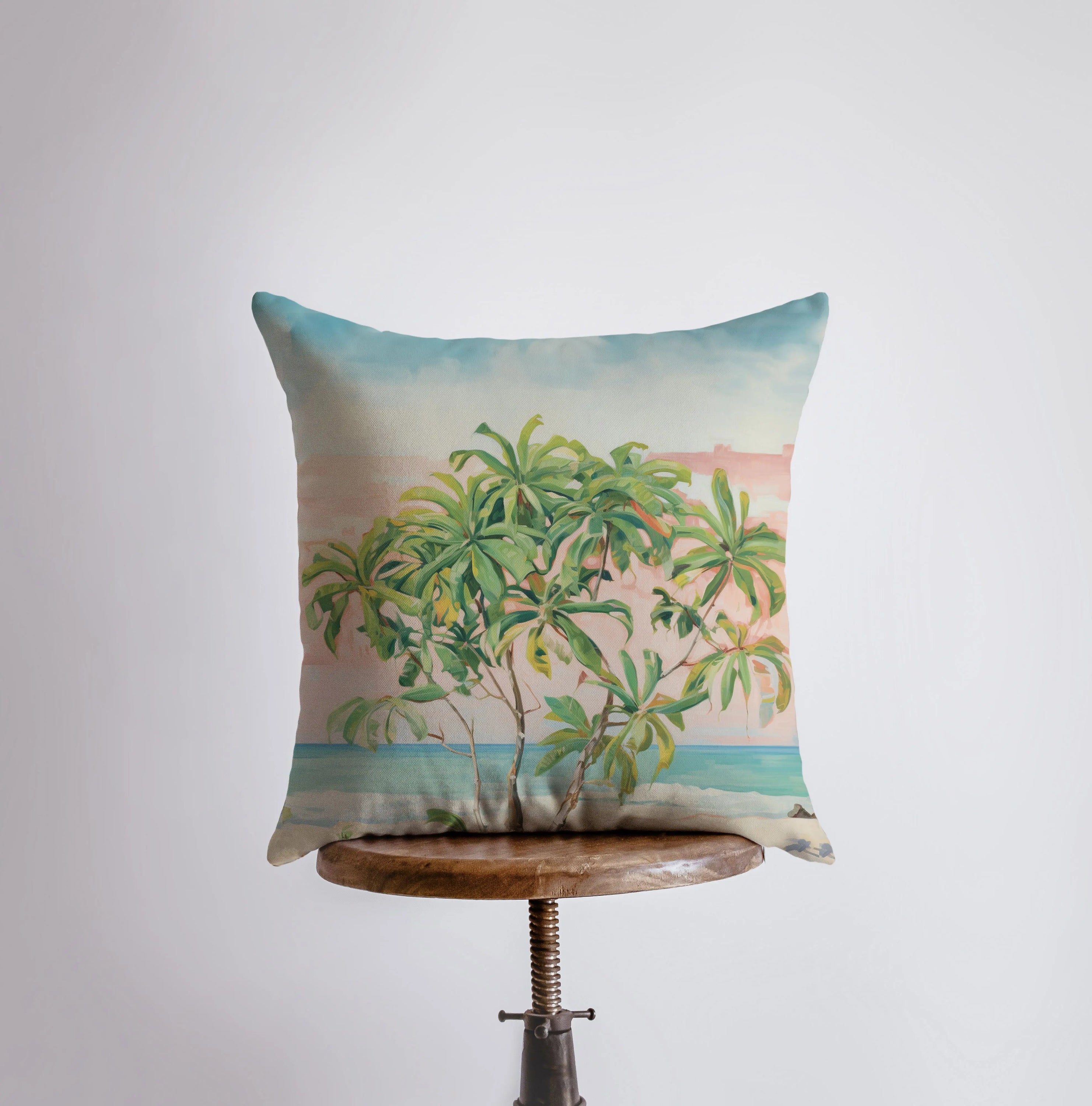 Sunset Beach Tree throw pillow featuring a palm tree design against a vibrant sunset, made from a cotton/polyester blend with a concealed zipper.