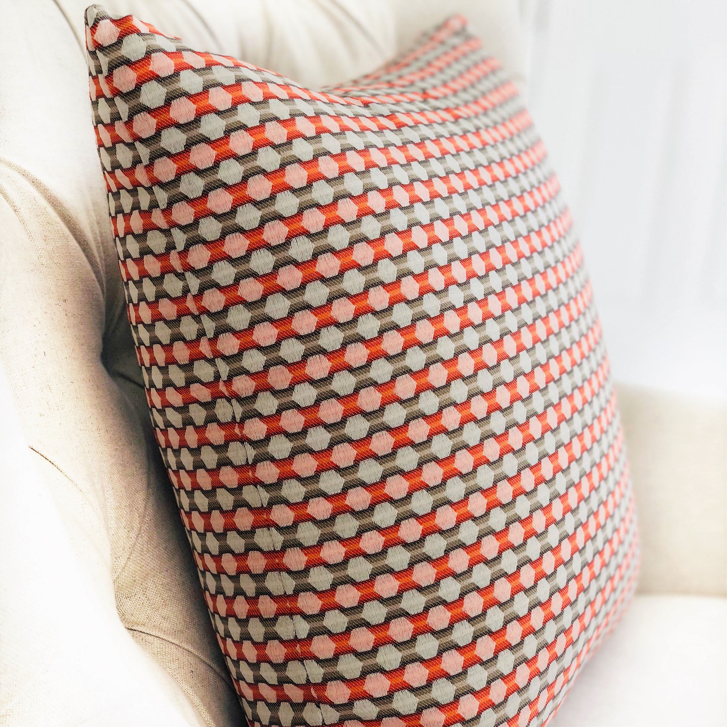 Sunny Cave Orange and Beige Luxury Throw Pillow with geometric pattern, showcasing its elegant design and high-quality fabric.