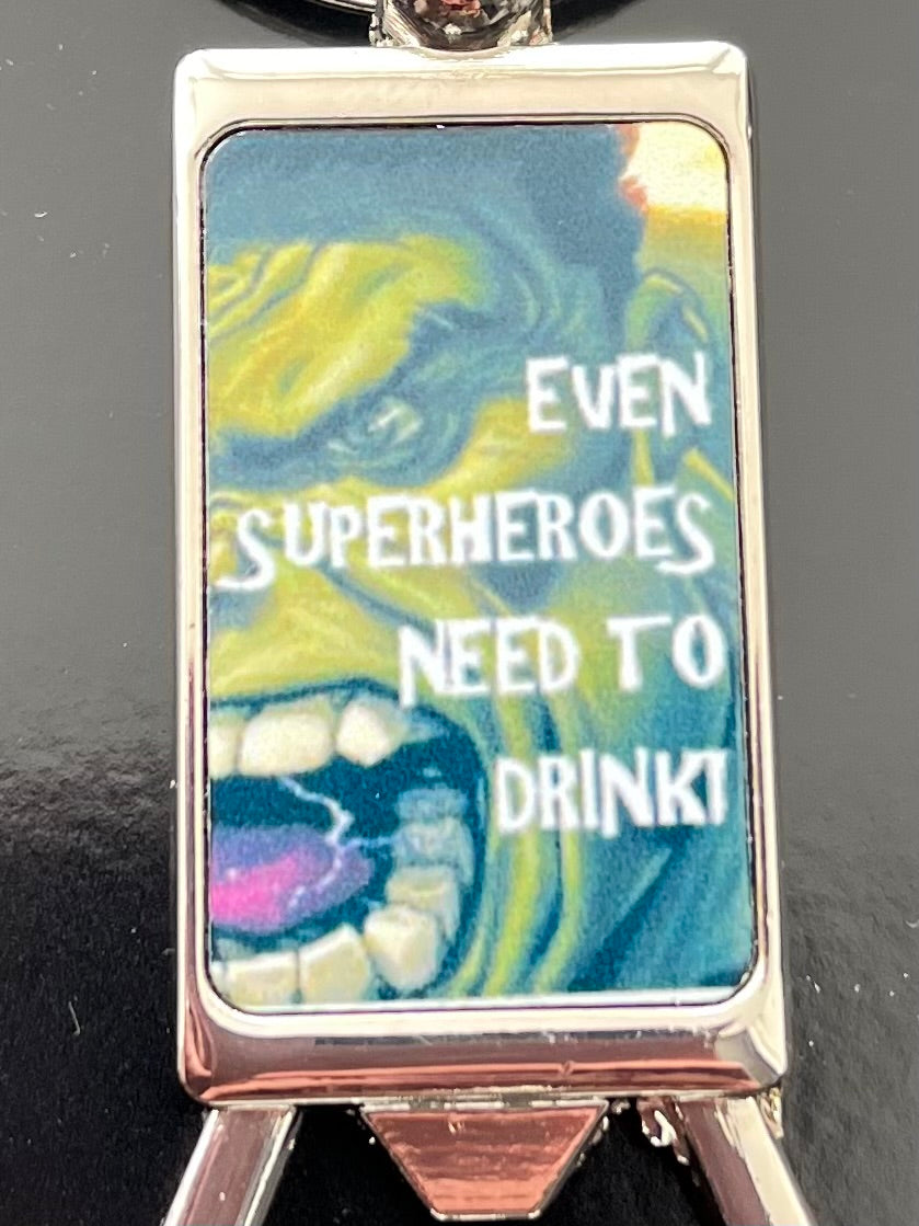 A colorful collection of superhero bottle opener keyrings featuring iconic superhero designs, perfect for fans and practical use.